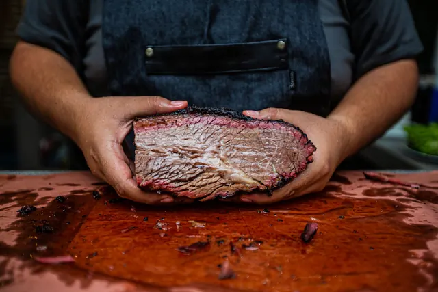 The same brisket on the cutting board, second angle.