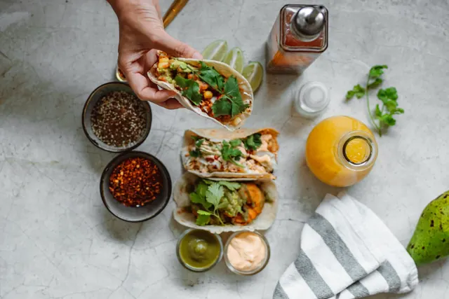 The same tacos picked up by hand, second angle.